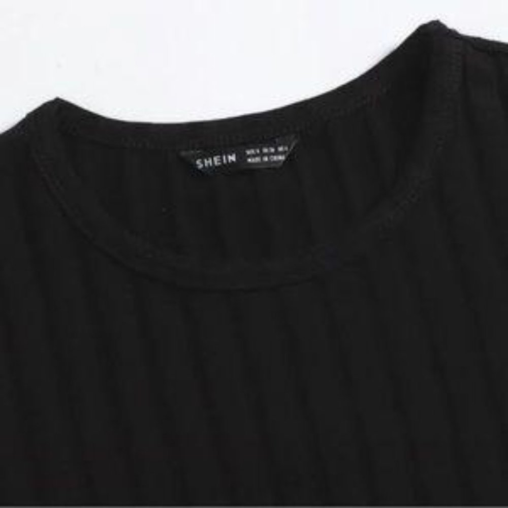 MmrJ NWT Black, ribbed, body con dress with ties on the side for shirring.